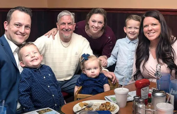 PHOTO: Transplant recipient David Bennett, Sr., center in white, poses with family members in a 2019 photo. (Byron Dillard via AP)