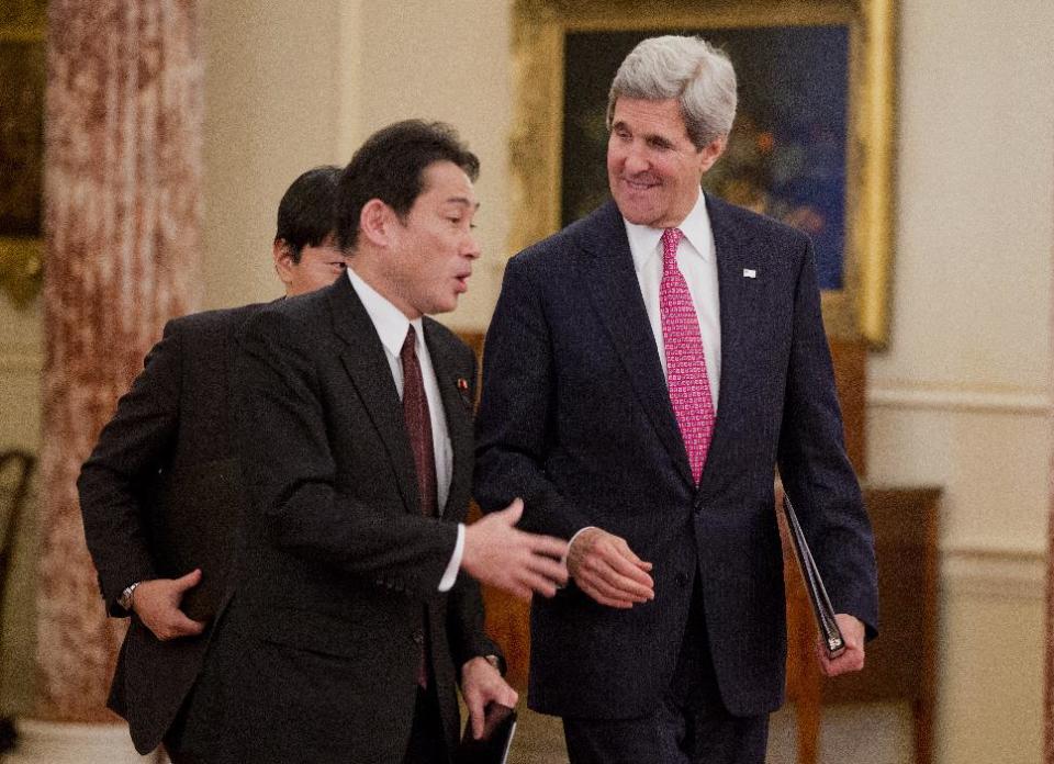 Secretary of State John Kerry walks with Japanese Foreign Minister Fumio Kishida to speak after their meeting at the State Department in Washington, Friday, Feb. 7, 2014. (AP Photo/ Evan Vucci)