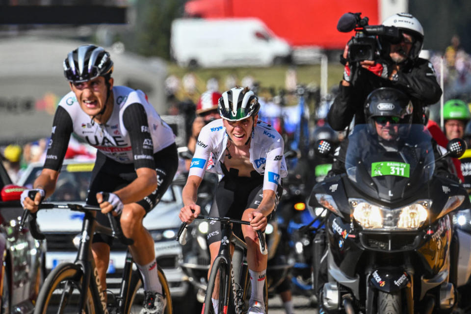 UAE Team Emirates' Slovenian rider Tadej Pogacar wearing the best young rider's white jersey (R) and UAE Team Emirates' Spanish rider Marc Soler (L) cycle in the ascent of Col de la Loze in the final kilometres of the 17th stage of the 110th edition of the Tour de France cycling race, 166 km between Saint-Gervais Mont-Blanc and Courchevel, in the French Alps, on July 19, 2023. (Photo by Marco BERTORELLO / AFP)