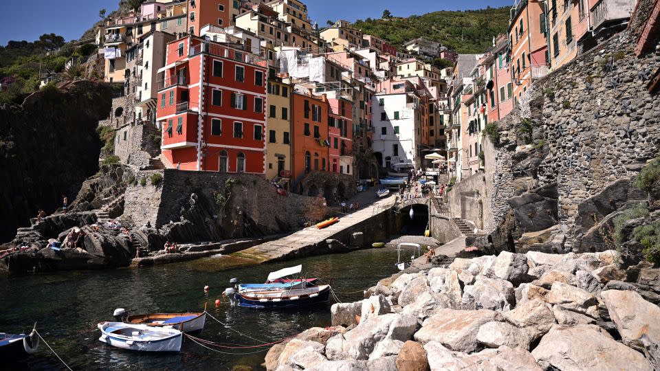 Brightly colored buildings can be seen in the village of Riomaggiore, one of the five villages that make up Cinque Terre. "Path of Love" runs from here to Manarola. - Marco Bertorello/AFP/Getty Images