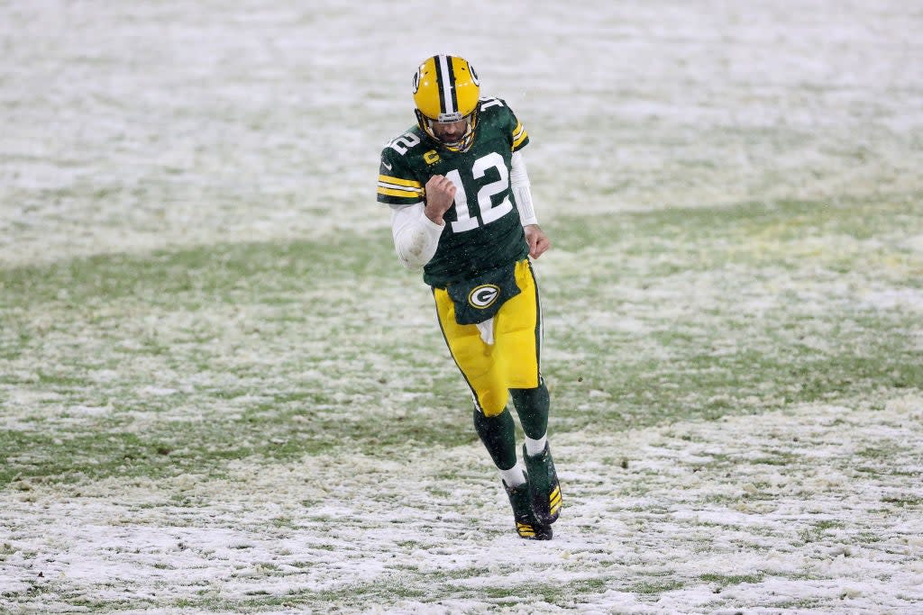 Aaron Rodgers meets the Rams in his first play-off game this season (Getty)