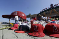 Angle Lozano stands at a memorial to give his condolences for Los Angeles Angels pitcher Tyler Skaggs at Angel Stadium in Anaheim, Calif., Tuesday, July 2, 2019. The 27-year-old left-hander died in his Texas hotel room, where he was found unresponsive Monday afternoon. (AP Photo/Chris Carlson)