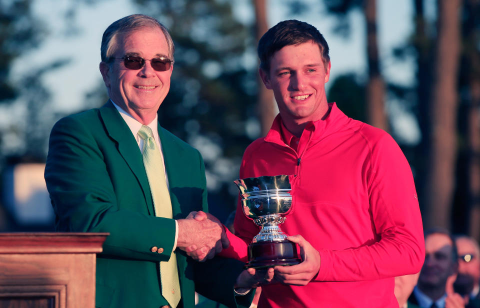 DeChambeau holds the low amateur trophy at the 2016 Masters