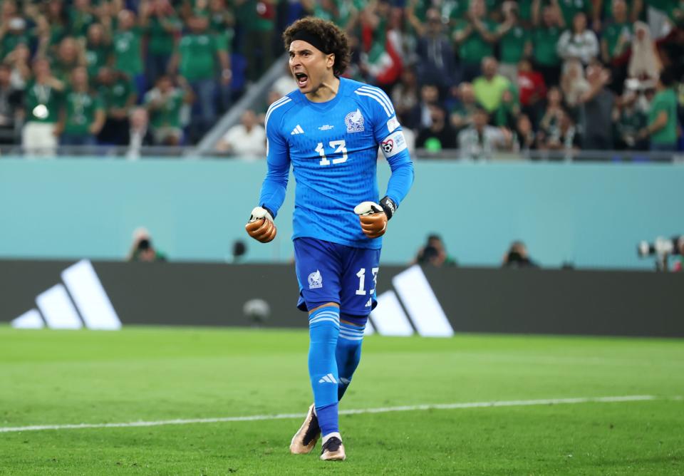 DOHA, QATAR - NOVEMBER 22: Guillermo Ochoa of Mexico reacts after saving a penalty from Robert Lewandowski of Poland (not pictured)  during the FIFA World Cup Qatar 2022 Group C match between Mexico and Poland at Stadium 974 on November 22, 2022 in Doha, Qatar. (Photo by Alex Grimm/Getty Images)