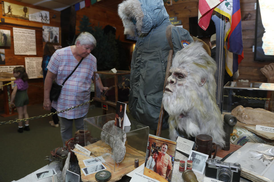 This Aug. 8, 2019, photo shows a Bigfoot mask and other items donated by the family of Yeti researcher Tom Slick on display at Expedition: Bigfoot! The Sasquatch Museum in Cherry Log, Ga. The owner of this intriguing piece of Americana at the southern edge of the Appalachians is David Bakara, a longtime member of the Bigfoot Field Researchers Organization who served in the Navy, drove long-haul trucks and tended bar before opening the museum in early 2016 with his wife, Malinda. (AP Photo/John Bazemore)