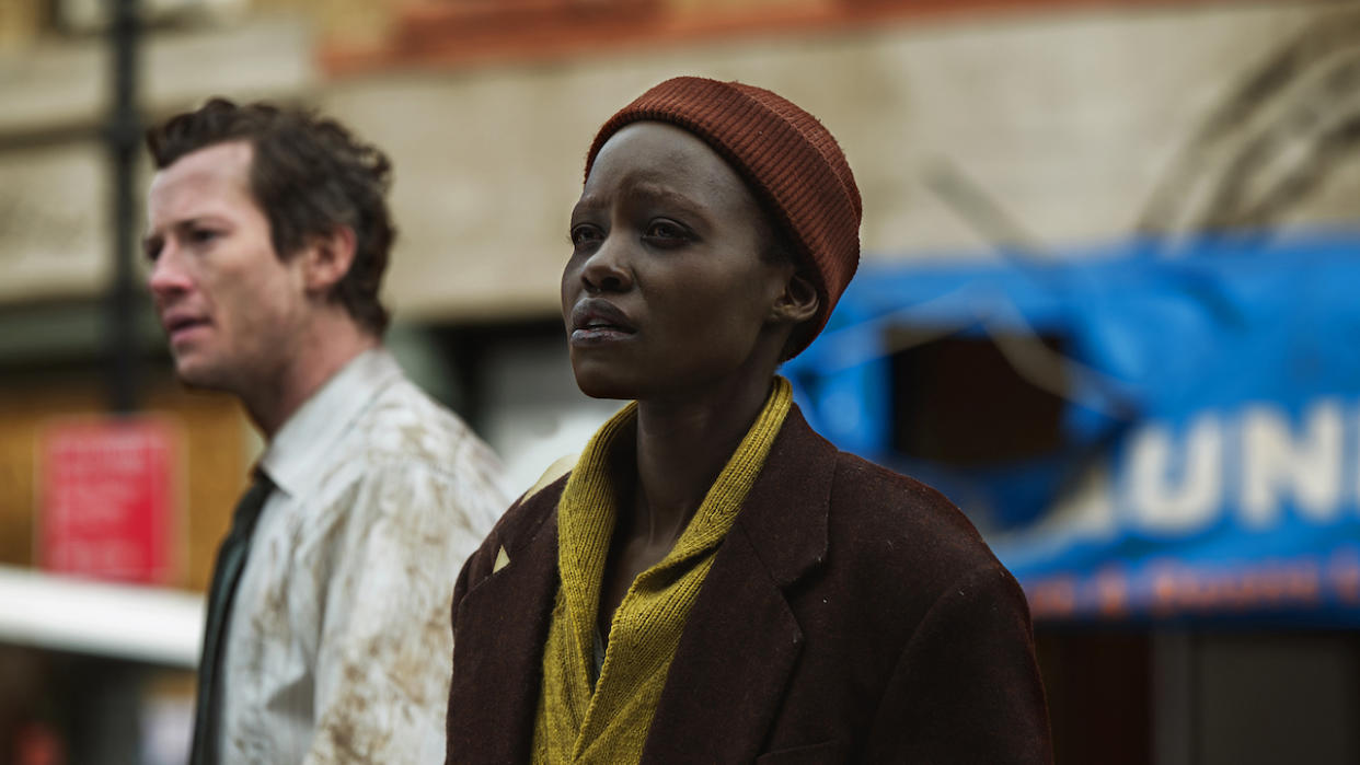  Lupita Nyong'o on the street looking forward in A Quiet Place: Day One. 