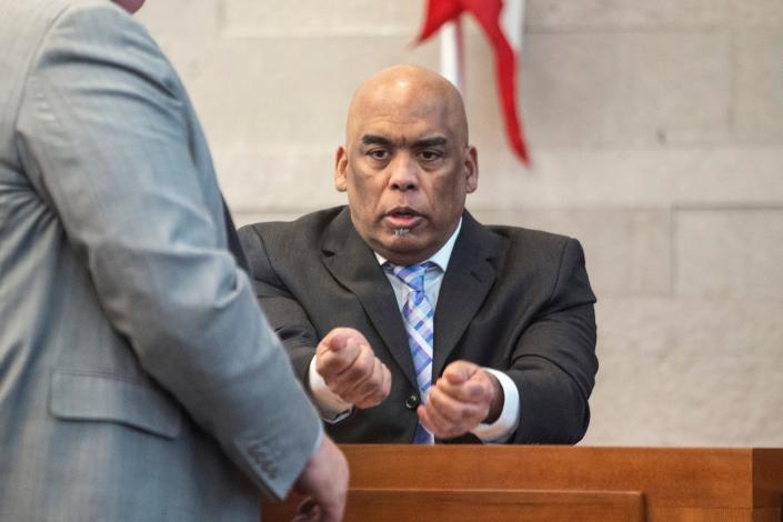 Former Columbus police vice officer Andrew Mitchell gestures with his hands to describe his physical altercation with 23-year-old Donna Castleberry before she cut him with a knife and he fatally shot her on Aug. 23, 2018. Mitchell was answering a question from one of his defense attorneys, Mark Collins, while taking the stand in his own defense at his trial on murder charges.
