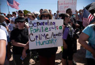 People participate in a protest against a recent U.S. immigration policy of separating children from their families when they enter the United States as undocumented immigrants, outside the Tornillo Tranit Centre, in Tornillo, Texas, U.S. June 17, 2018. REUTERS/Monica Lozano