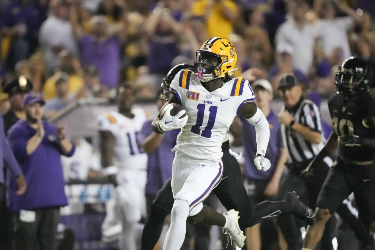 LSU wide receiver Brian Thomas Jr. (11) runs for a touchdown