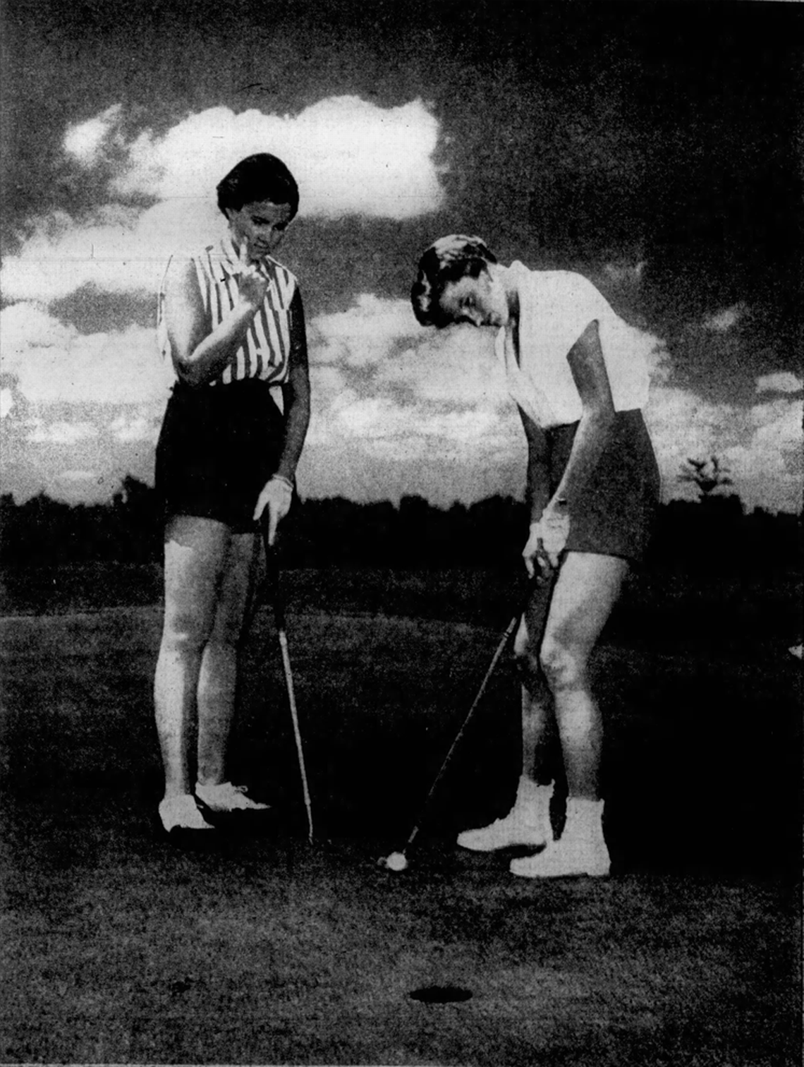 Natasha (Matson) Fife stands over a putt, while Judy Bell watches in a 1955 cover picture in the Wichita Eagle.