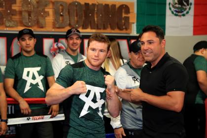 Canelo Alvarez, left, and Oscar De La Hoya are making the smart play in waiting to face Gennady Golovkin. (Getty Images)