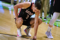 Davidson's Sam Mennenga reacts after the team's loss to Michigan State in a college basketball game in the first round of the NCAA men's tournament Friday, March 18, 2022, in Greenville, S.C. (AP Photo/Brynn Anderson)