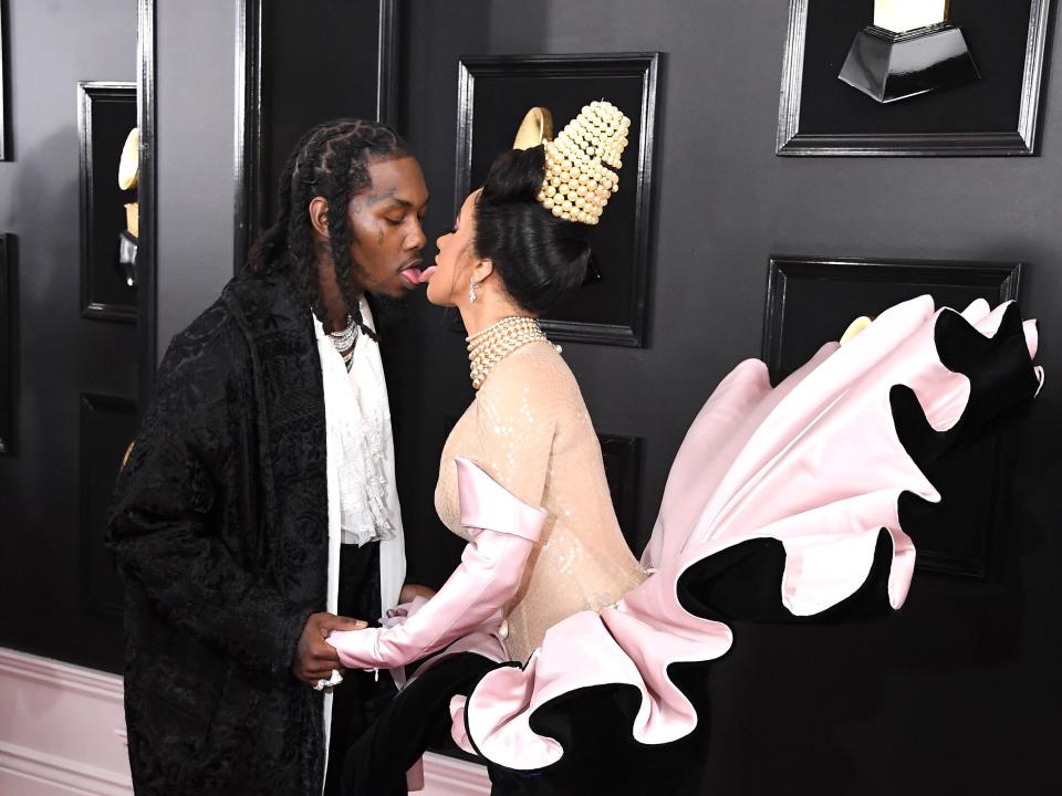 Cardi B and Offset touching tongues at the 2019 Grammys.