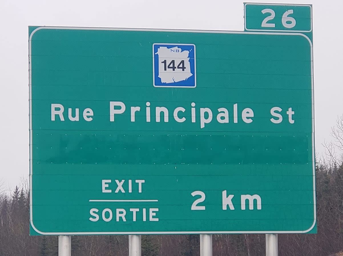 A green patch was seen on Trans-Canada Highway signs in Edmundston for two weeks, covering up the name of local village Saint-Basile. (Submitted by Jean-Claude D'Amours - image credit)