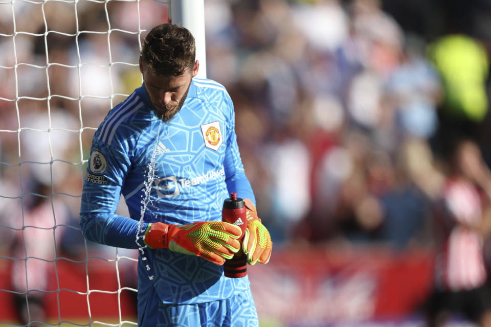 Manchester United's goalkeeper David de Gea spits out water after taking a drink during the English Premier League soccer match between Brentford and Manchester United at the Gtech Community Stadium in London, Saturday, Aug. 13, 2022. (AP Photo/Ian Walton)