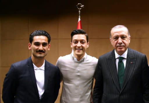 The picture which sparked a storm - Ilkay Gundogan (L) and Mesut Ozil (C) were heavily criticised in Germany for their meeting with Turkish president Recep Tayyip Erdogan in London in May