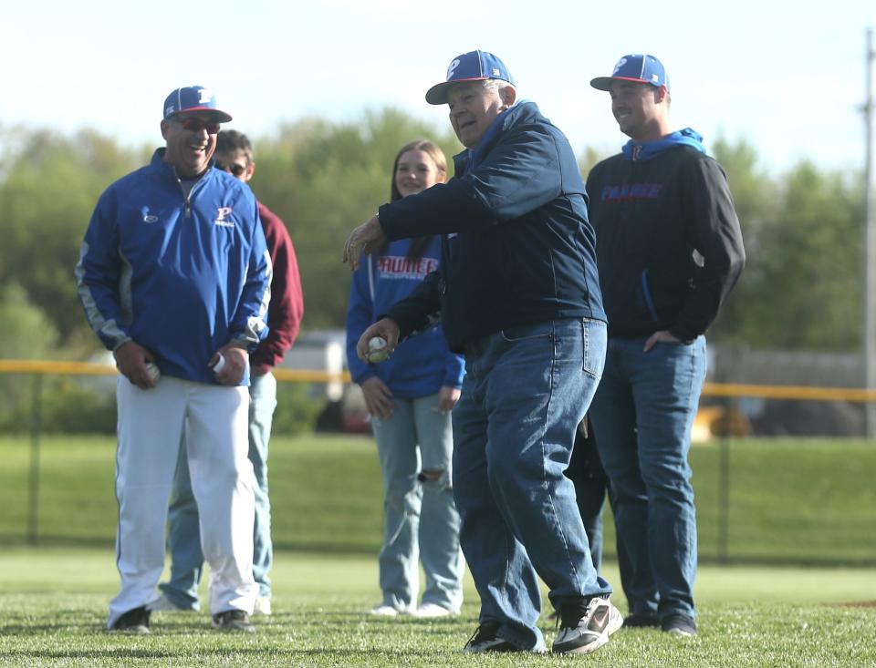 Roger Kratochvil throws out the first pitch ahead of Pawnee's nonconference home game against Taylorville on Saturday, April 20, 2024. Both teams recognized Roger's son, Tim, prior to the game.