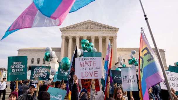 PHOTO: A person holds a sign that reads 'There's No Hate Like Christian Love' as people on both sides of a debate rally outside the Supreme Court, Dec. 5, 2022.  (Andrew Harnik/AP)