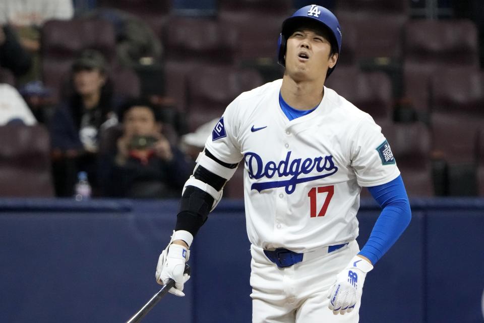 Los Angeles Dodgers' designated hitter Shohei Ohtani reacts after he was struck out during the second inning of the exhibition game between the Los Angeles Dodgers and Kiwoom Heroes at the Gocheok Sky Dome in Seoul, South Korea, Sunday, March 17, 2024. The Los Angeles Dodgers and the San Diego Padres will meet in a two-game series on March 20th-21st in Seoul for the MLB World Tour Seoul Series. (AP Photo/Ahn Young-Joon)