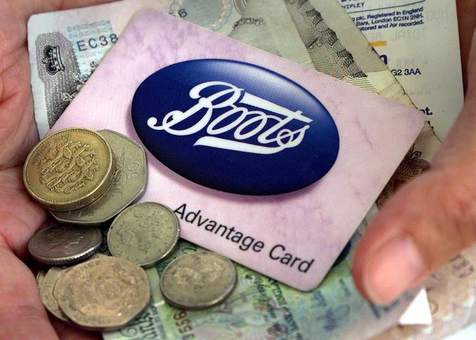 A loyalty card from the British chain store Boots is seen amongst
change in London July 26, 2001. Britain's leading health and beauty
retailer reported stronger than expected first quarter sales at its
core chemist chain but a sharp downturn at its over-the-counter drugs
arm.

JDP/