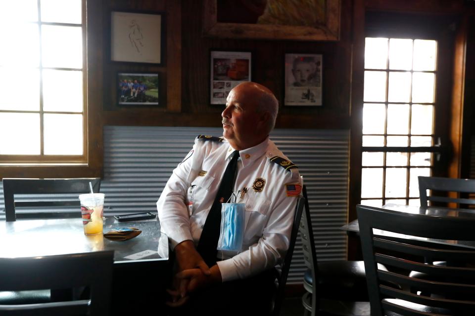 Collierville Fire Chief Buddy Billings sits down for a meal as one of the first customers at the Collierville Commissary BBQ, as they reopen for dine-in service on Monday, May 4, 2020. 