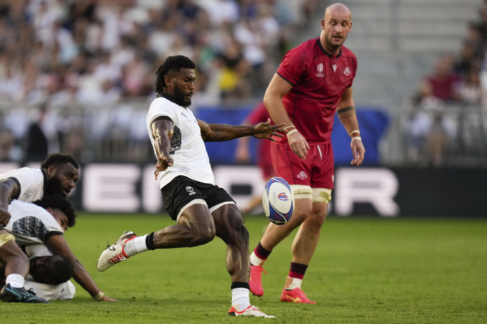 Fiji's Frank Lomani kicks the ball during the Rugby World Cup Pool C match between Fiji and Georgia at the Stade de Bordeaux in Bordeaux, France, Saturday, Sept. 30, 2023. (AP Photo/Thibault Camus)