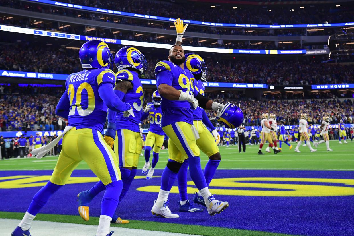 Jan 30, 2022; Inglewood, California, USA; Los Angeles Rams defensive end Aaron Donald (99) celebrates in the fourth quarter during the NFC Championship Game against the San Francisco 49ers at SoFi Stadium. Mandatory Credit: Gary A. Vasquez-USA TODAY Sports