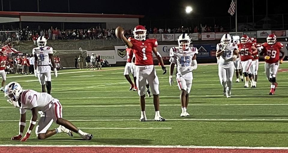 Ruston's Aaron Jackson signals a first down after making a big catch against Zachary Friday in the LHSAA Non-Select Division I semifinal contest in Ruston's LJ &quot;Hoss&quot; Garrett Stadium.