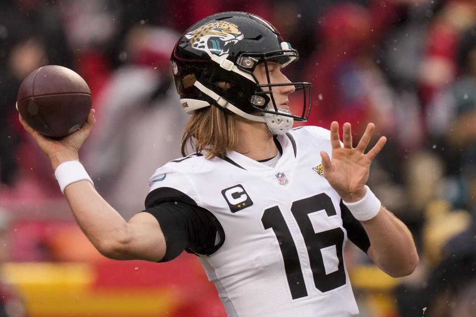 Jacksonville Jaguars quarterback Trevor Lawrence (16) passes from the pocket against the Kansas City Chiefs during the first half of an NFL divisional round playoff football game, Saturday, Jan. 21, 2023, in Kansas City, Mo. (AP Photo/Charlie Riedel)