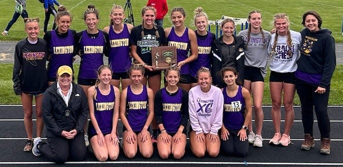 The Lexington girls celebrate a Division II district championship. Ten girls are moving on to the state meet.