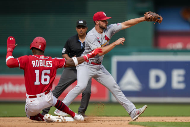 Washington Nationals' Victor Robles climbs the steps to the dugout