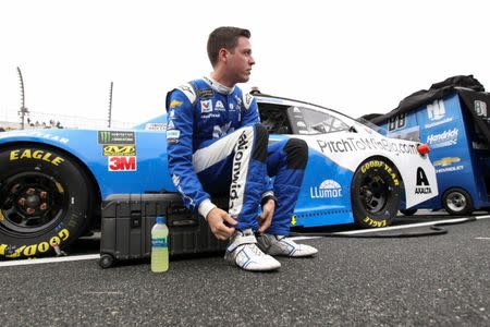 FILE PHOTO: May 5, 2019; Dover, DE, USA; NASCAR Cup Series driver Alex Bowman puts on his heat shields prior to the Gander RV 400 at Dover International Speedway. Matthew O'Haren-USA TODAY Sports