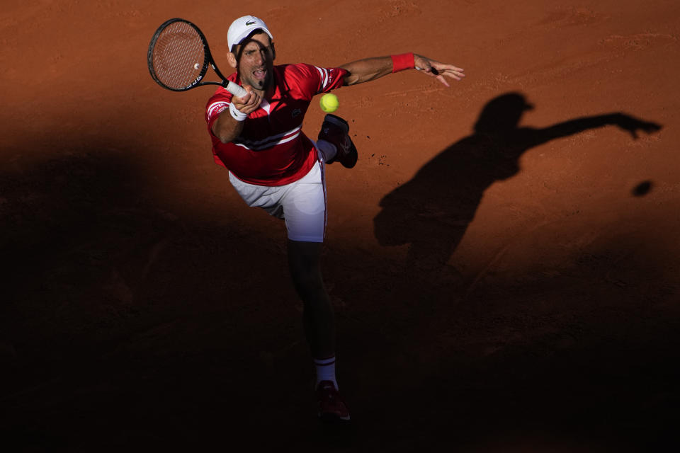 Serbia's Novak Djokovic returns the ball to Stefanos Tsitsipas of Greece during their final match of the French Open tennis tournament at the Roland Garros stadium Sunday, June 13, 2021 in Paris. (AP Photo/Christophe Ena)