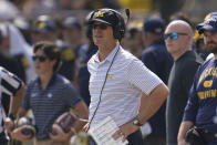 Michigan head coach Jim Harbaugh watches in the first half of an NCAA college football game against Connecticut in Ann Arbor, Mich., Saturday, Sept. 17, 2022. (AP Photo/Paul Sancya)