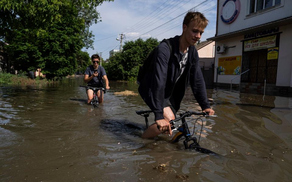 Locals on the Ukrainian side have continued to continue as 'normal' - Evgeniy Maloletka/AP