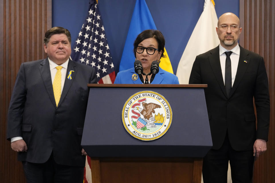 U.S. Special Representative for Ukraine's Economic Recovery Penny Pritzker, center, speaks as Illinois Gov. J.B. Pritzker, left, and Ukrainian Prime Minister Denys Shmyhal listen to her at a news conference in Chicago, Tuesday, April 16, 2024. They delivered joint remarks recognizing the Illinois-Ukraine partnership. (AP Photo/Nam Y. Huh)