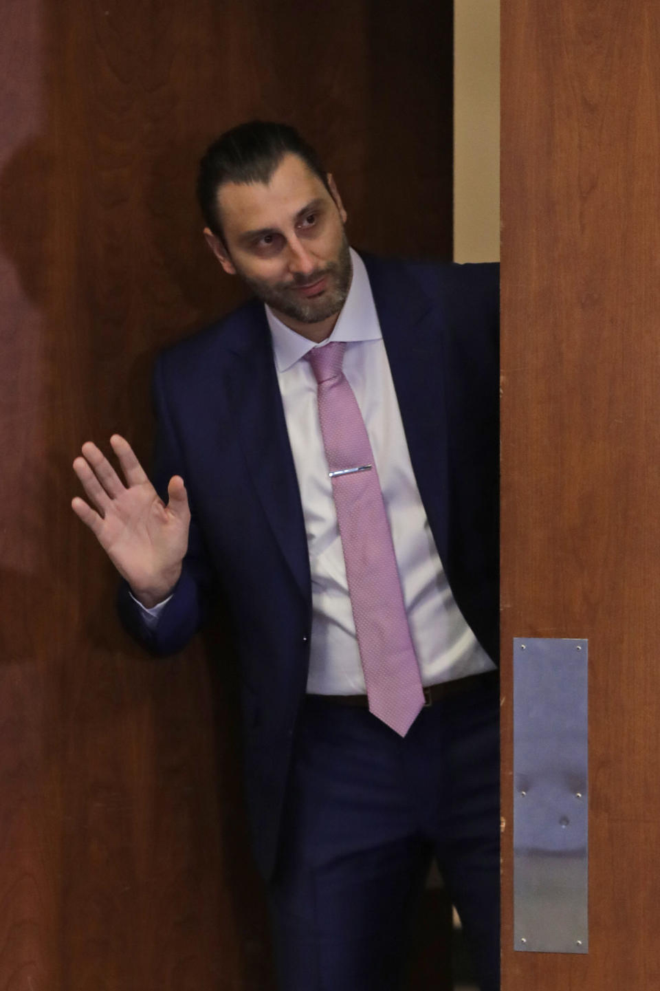 Former Florida Panthers goalie Roberto Luongo waves to members of the media as he arrives at a news conference before a jersey retirement ceremony, Saturday, March 7, 2020, in Sunrise, Fla. (AP Photo/Wilfredo Lee)