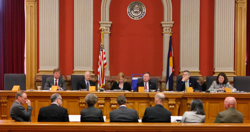 Subcommittee members, top row, on Energy and Mineral Resources listen to testimony during a hearing on proposed nationwide drilling rules on hydraulic fracturing at the Capitol in Denver on Wednesday, May 2, 2012. From top left: Rep. Scott Tipton, R-Colo., Rep. Mike Coffman, R-Colo., a staff member, Rep. Doug Lamborn, R-Colo., Rep. Rush Holt, D-N.J., and Rep. Diane DeGette, D-Colo. (AP Photo/Ed Andrieski)
