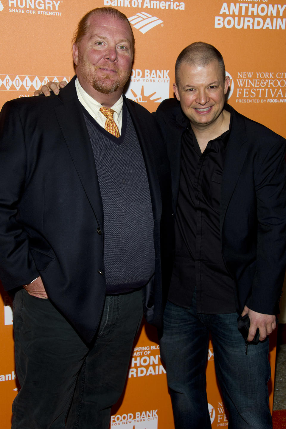 Mario Batali, left, and Jim Norton attend "On The Chopping Block: A Roast of Anthony Bourdain" on Thursday, Oct. 11, 2012 in New York. (Photo by Charles Sykes/Invision/AP Images)