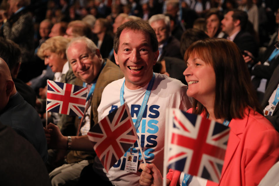 Delegates cheer with Union Jack flags to Prime Minister Boris Johnson's arrival to  deliver his keynote speech on the final day of the Conservative Party Conference being held at the Manchester Convention Centre. Picture dated: Wednesday October 2, 2019. Photo credit should read: Isabel Infantes / EMPICS Entertainment.
