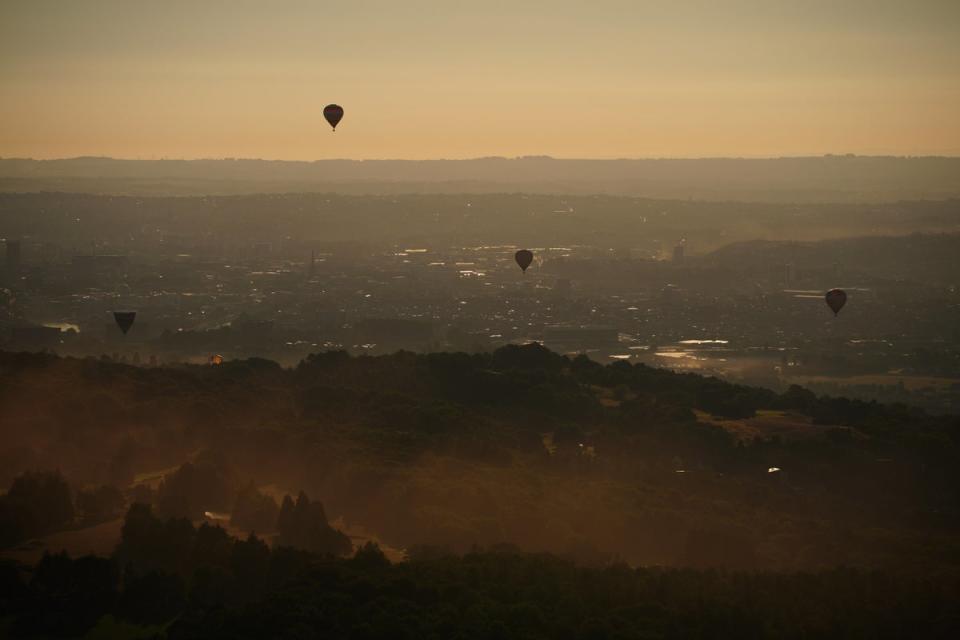 Balloons against an early morning Bristol skyline (Ben Birchall/PA) (PA Wire)