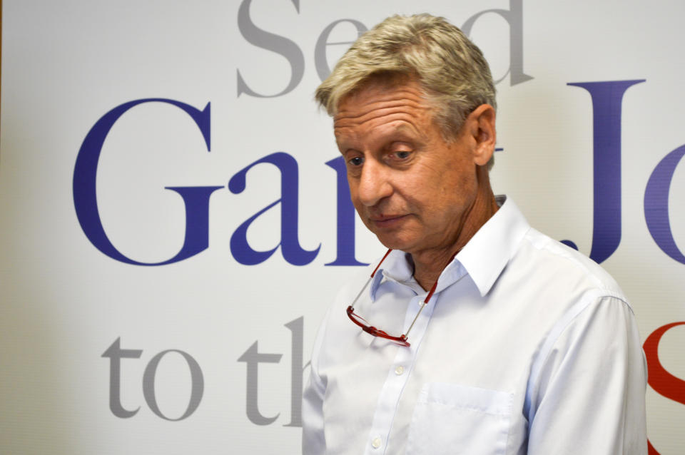 Former Libertarian presidential candidate Gary Johnson talks to reporters on Thursday, Aug. 16, 2018, about his decision to join the U.S. Senate race in New Mexico. (AP Photo/ Russell Contreras)