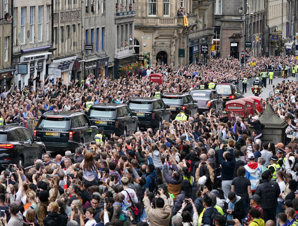 Crowds watch as the hearse carrying the coffin of Queen Elizabeth II was taken through the centre of Edinburgh to the Palace of Holyroodhouse (Ian Forsyth/PA)