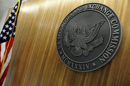 FILE PHOTO: The seal of the U.S. Securities and Exchange Commission hangs on the wall at SEC headquarters in Washington, U.S., June 24, 2011. REUTERS/Jonathan Ernst/File Photo