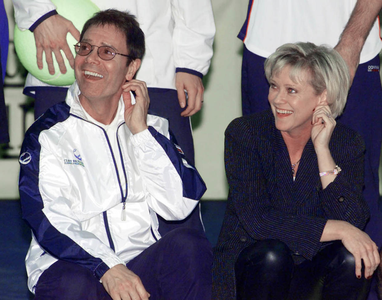 Singer Sir Cliff Richard,  and former British tennis star and television sports presenter Sue Barker, at The London Arena in Docklands, for the York tennis challenge cup for the charity Children in Crisis.   (Photo by Sean Dempsey - PA Images/PA Images via Getty Images)