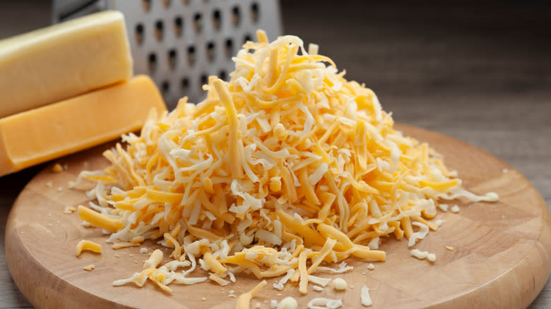 grated cheese on board