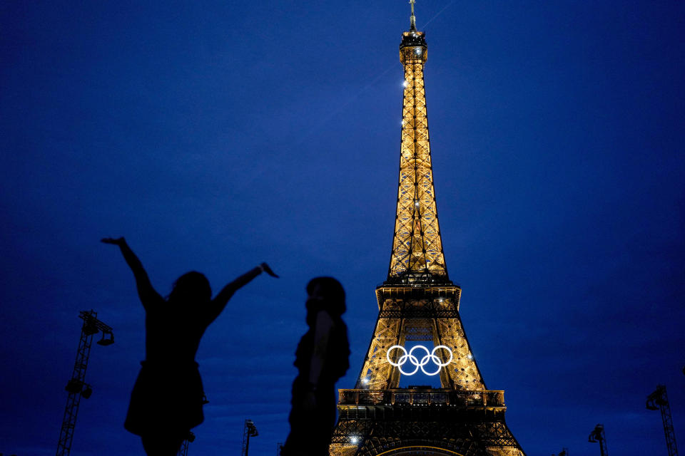 The United States' Amarilees Bolorin, left, takes a selfie with a friend in front of the Eiffel Tower ahead of the 2024 Summer Olympics, Thursday, July 25, 2024, in Paris, France. (AP Photo/Natacha Pisarenko)