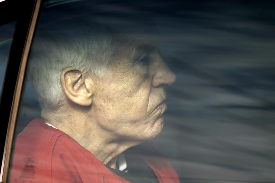 Former Penn State University assistant football coach Jerry Sandusky is driven from the Centre County Courthouse after being sentenced in Bellefonte, Pa., Tuesday, Oct. 9, 2012. Sandusky was sentenced to at least 30 years in prison, effectively a life sentence, in the child sexual abuse scandal that brought shame to Penn State and led to coach Joe Paterno's downfall. (AP Photo/Matt Rourke)