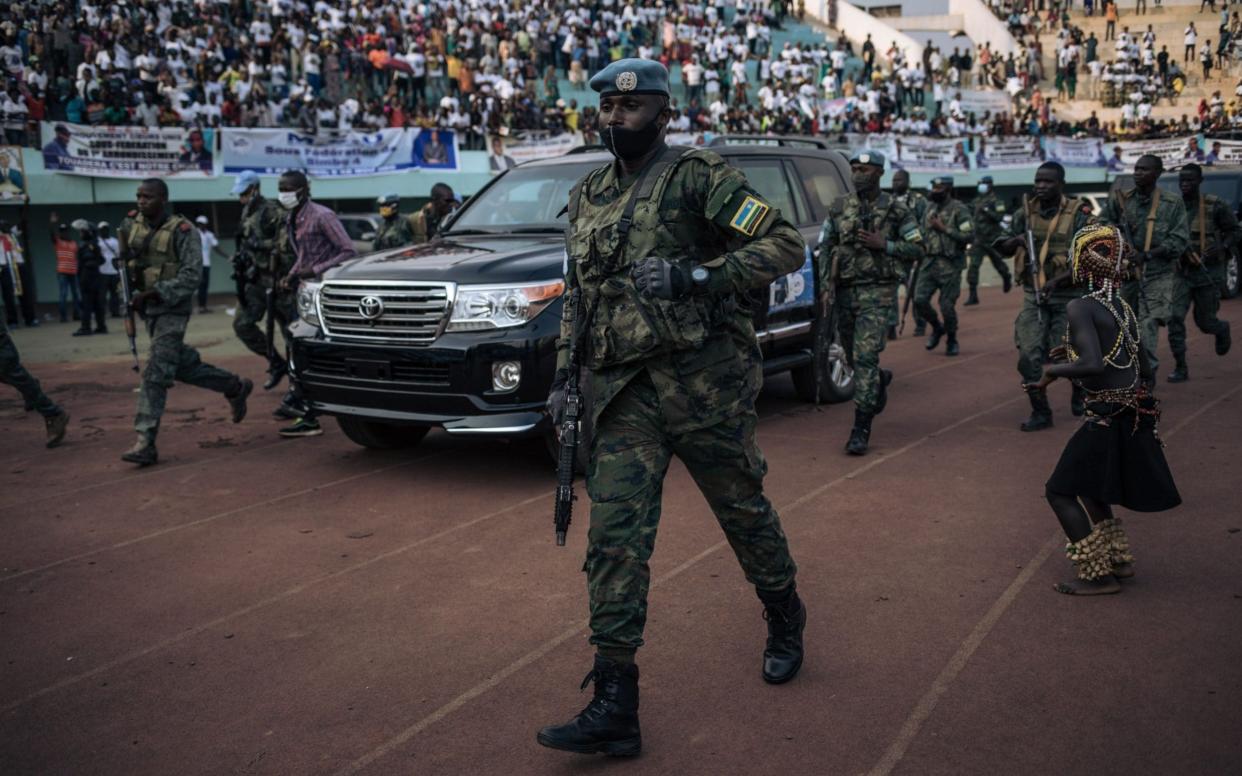 The motorcade of the Central African Republic president, Faustin-Archange Touadéra, at a rally last week, accompanied by the presidential guard, Russian mercenaries, and Rwandan UN peacekeepers, in Bangui - Alexis Huguet/AFP