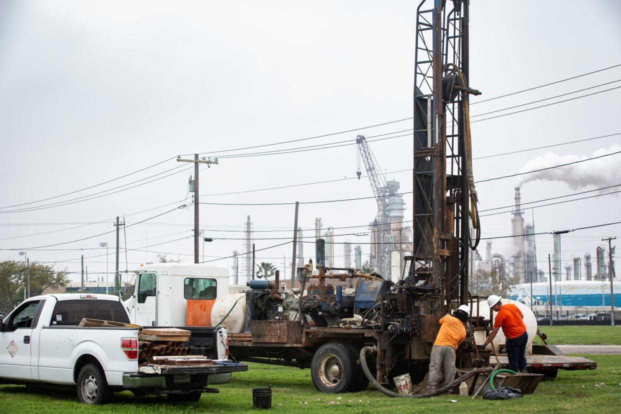 Workers take soil samples using a geotechnical boring method in a lot on Palm Drive and Summers Street on March 15. The samples are for the Inner Harbor Desalination Plant project.